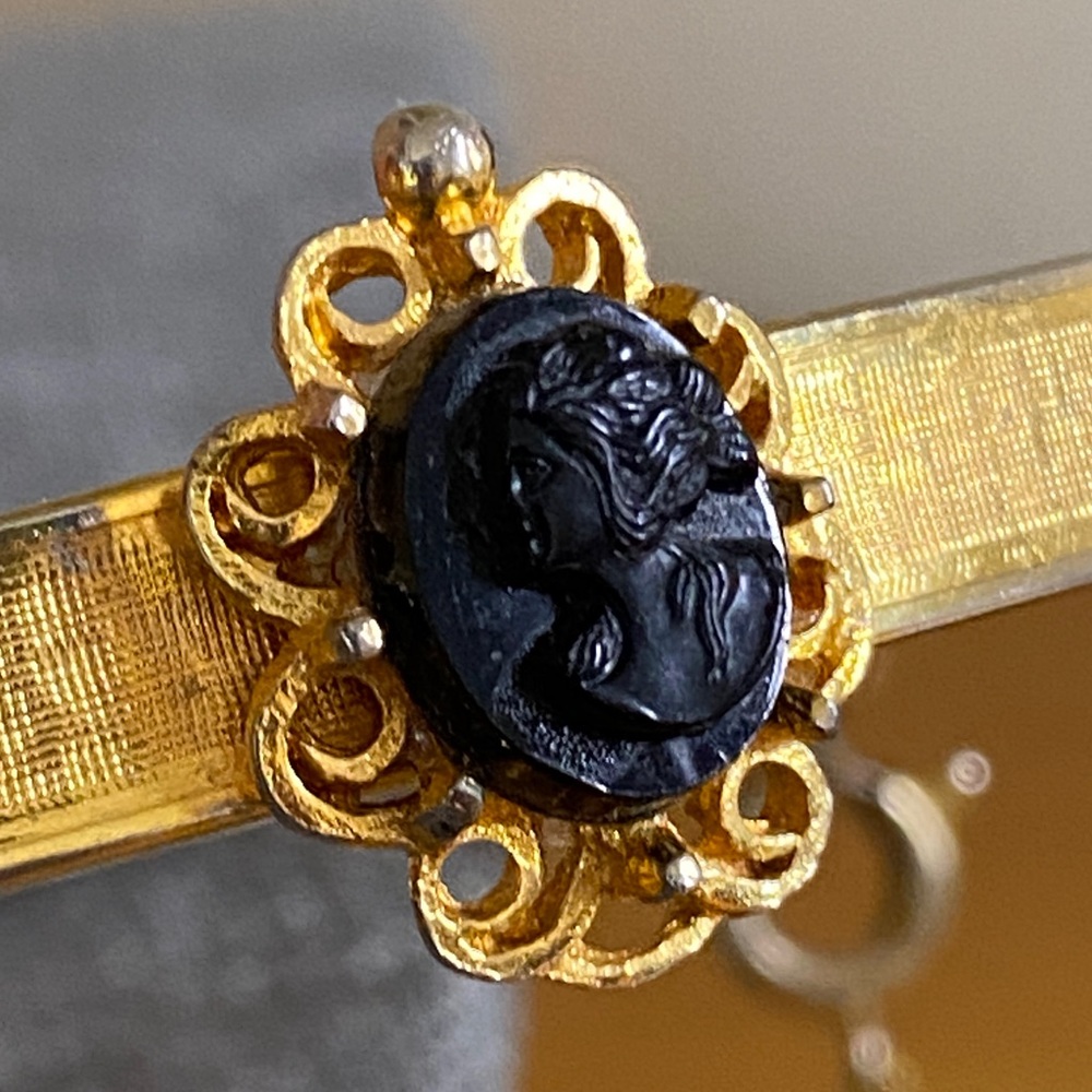 Vintage Gold-Tone Hinged Bangle Bracelet with Black Cameo & Safety Chain